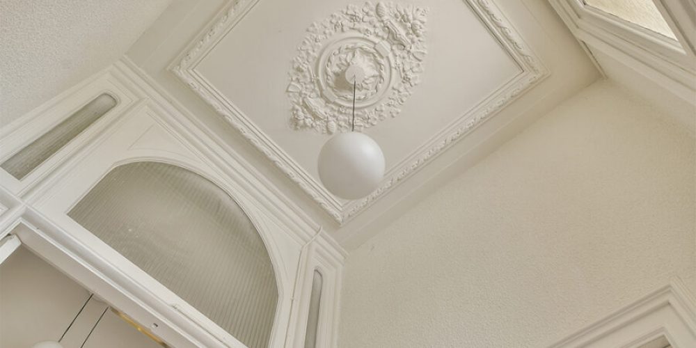 stucco-ornament-above-elegant-chandelier-2025-02-10-00-18-06-utc